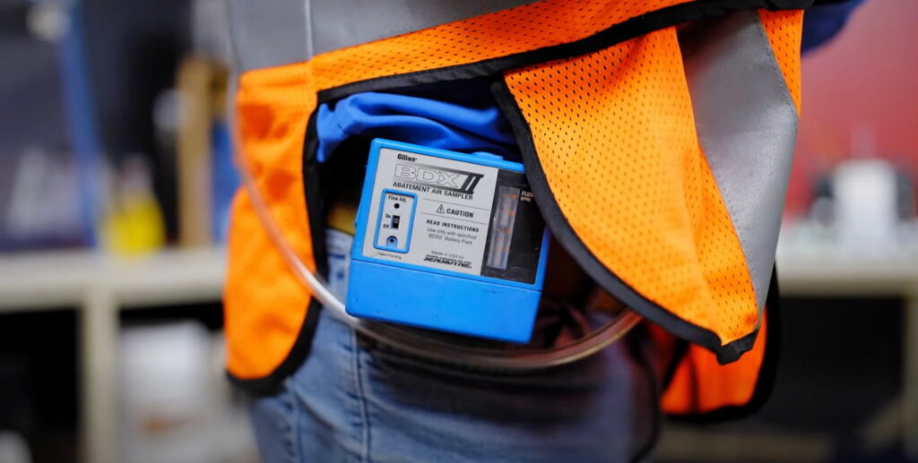 An industrial hygienist prepares to work at a site.