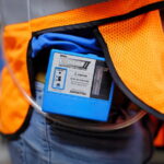 An industrial hygienist prepares to work at a site.